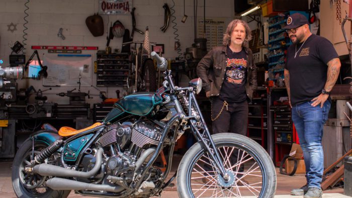 Indian Larry and Paul Cox next to the custom motorcycle built by Indian Larry, Paul Cox, and Keino Sasaki