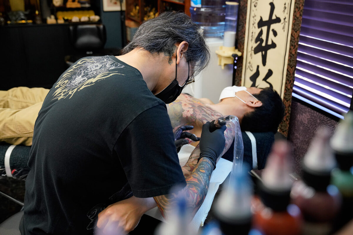 A view of Yokohama tattoo artist, Shige, in his Yellow Blaze tattoo parlour