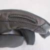 Visor wiper located on the inside of the left index finger.