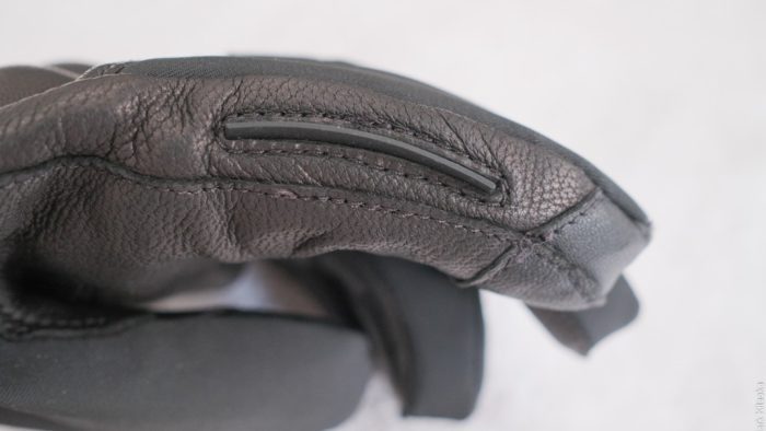 Visor wiper located on the inside of the left index finger. Visor wiper located on the inside of the left index finger.