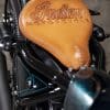 a view from above of the leather tooling completed by Paul Cox on the custom motorcycle built by Indian Larry, Paul Cox, and Keino Sasaki