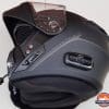 A view of the black Outrush R Modular Helmet with the chin bar up and the visor open