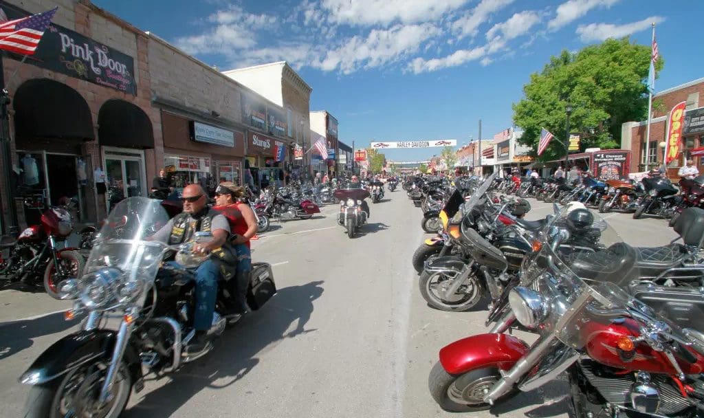 The Sturgis Rally, with multiple bikers sauntering around and doing their thing