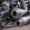 the Custom exhaust, built by Keino Sasaki, on the custom motorcycle built by Indian Larry, Paul Cox, and Keino Sasaki