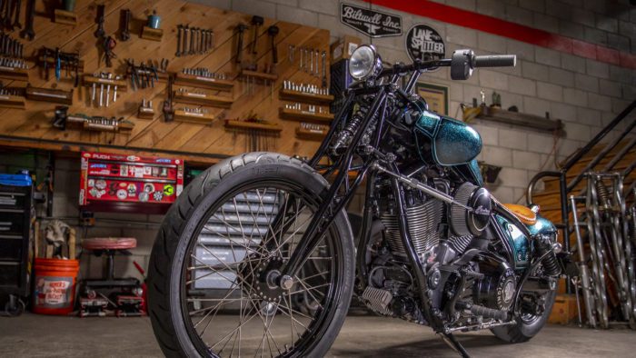 A front quarter view of the custom motorcycle built by Indian Larry, Paul Cox, and Keino Sasaki