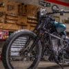 A front quarter view of the custom motorcycle built by Indian Larry, Paul Cox, and Keino Sasaki