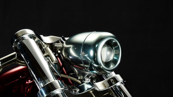 a side image of the headlight on the Bad Land 1992 EVO 300 Wide Tire Chopper, also known as ‘The Hades Chopper’. a side image of the headlight on the Bad Land 1992 EVO 300 Wide Tire Chopper, also known as ‘The Hades Chopper’.