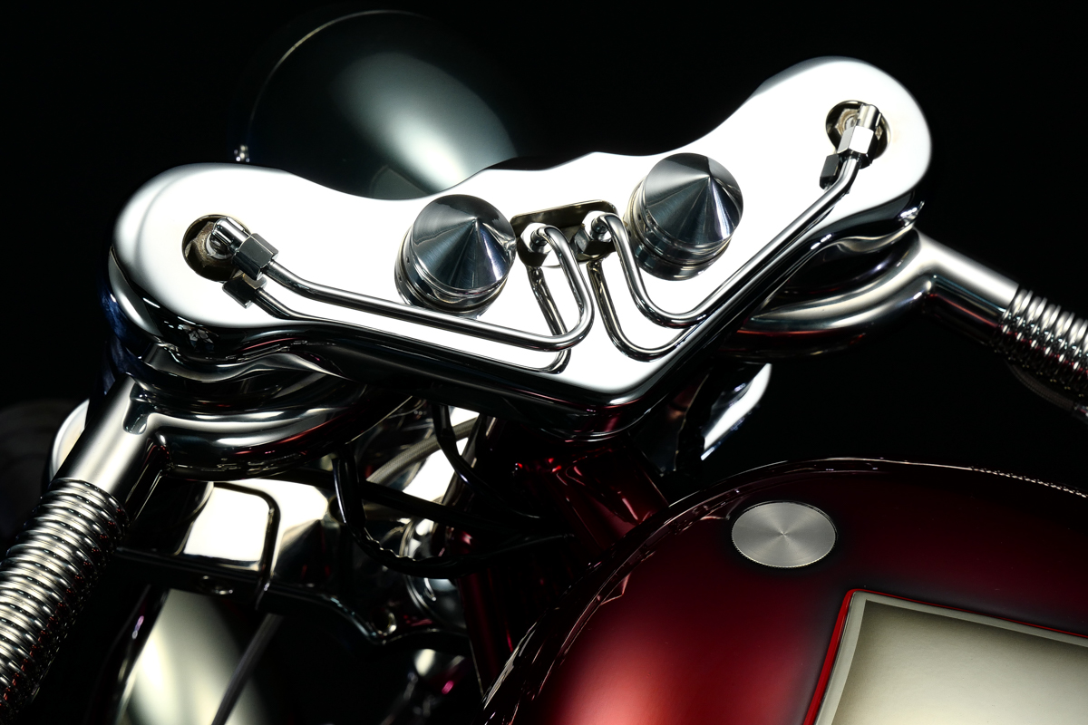 a view of the custom handlebars on the Bad Land 1992 EVO 300 Wide Tire Chopper, also known as ‘The Hades Chopper’. a view of the custom handlebars on the Bad Land 1992 EVO 300 Wide Tire Chopper, also known as ‘The Hades Chopper’.