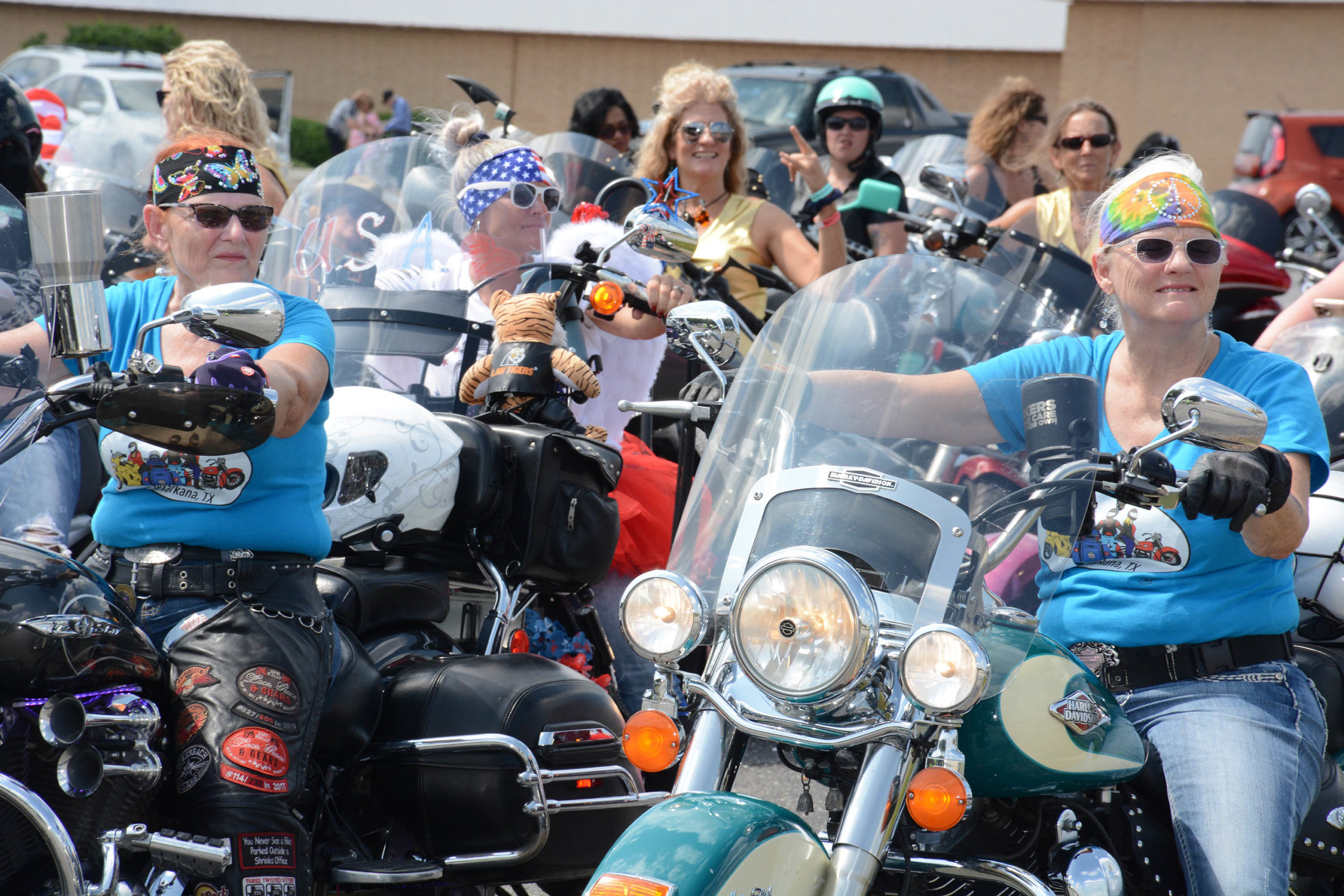 picture of various ladies in leather, riding together for a cause.