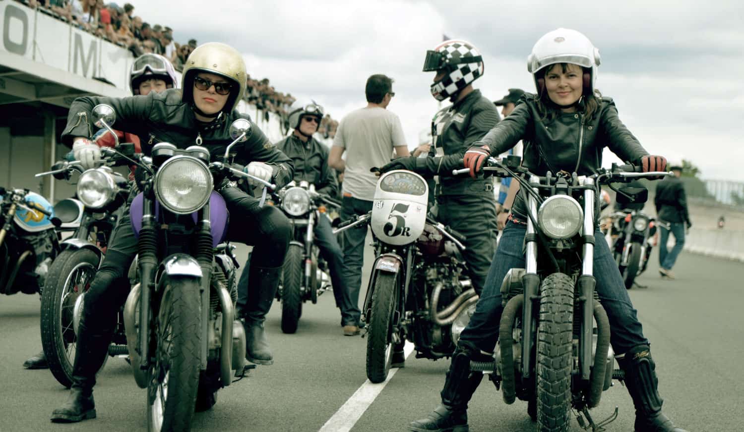 A view of female bikers enjoying a rider together.