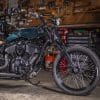 A pipe-side view of the custom motorcycle built by Indian Larry, Paul Cox, and Keino Sasaki