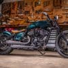 a pipe side view of the custom motorcycle built by Indian Larry, Paul Cox, and Keino Sasaki