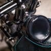 A close-up of the recessed tank completed by Keino Sasaki, on the custom motorcycle built by Indian Larry, Paul Cox, and Keino Sasaki