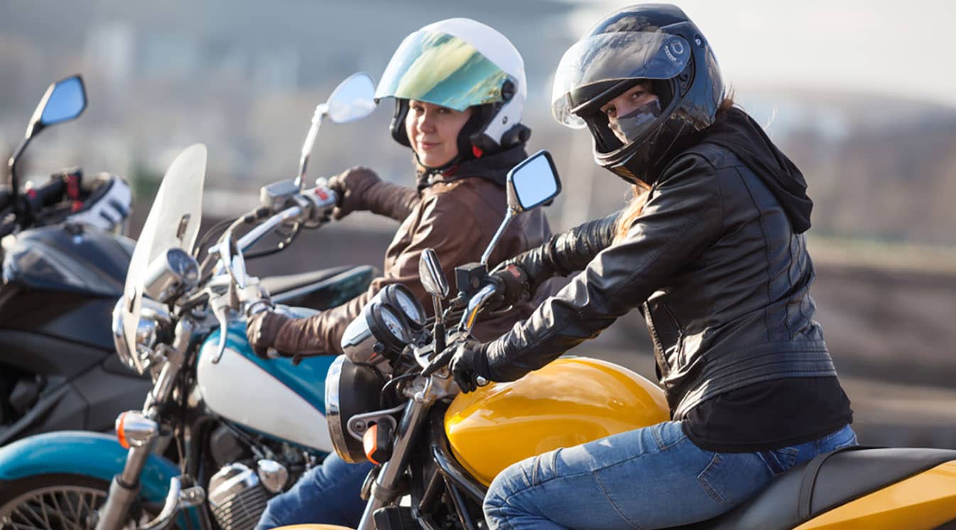 A picture of female motorcyclists riding together for a good cause