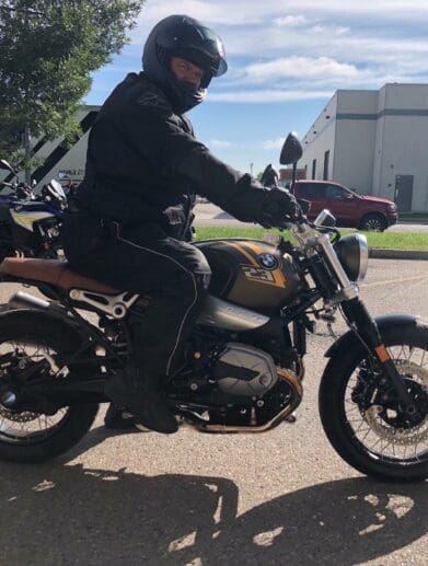 A side view of Simon Bertram on the 2021 BMW R NineT Scrambler