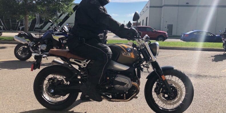 A side view of Simon Bertram on the 2021 BMW R NineT Scrambler