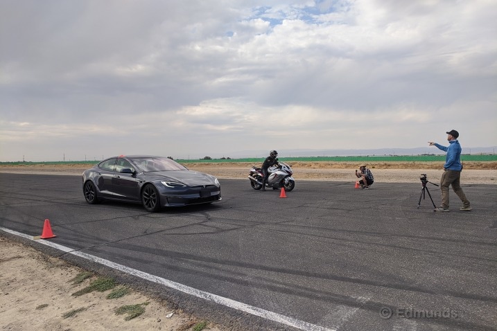 A view of a Tesla Model S Plaid next to a 2021 Kawasaki Ninja ZX-14R