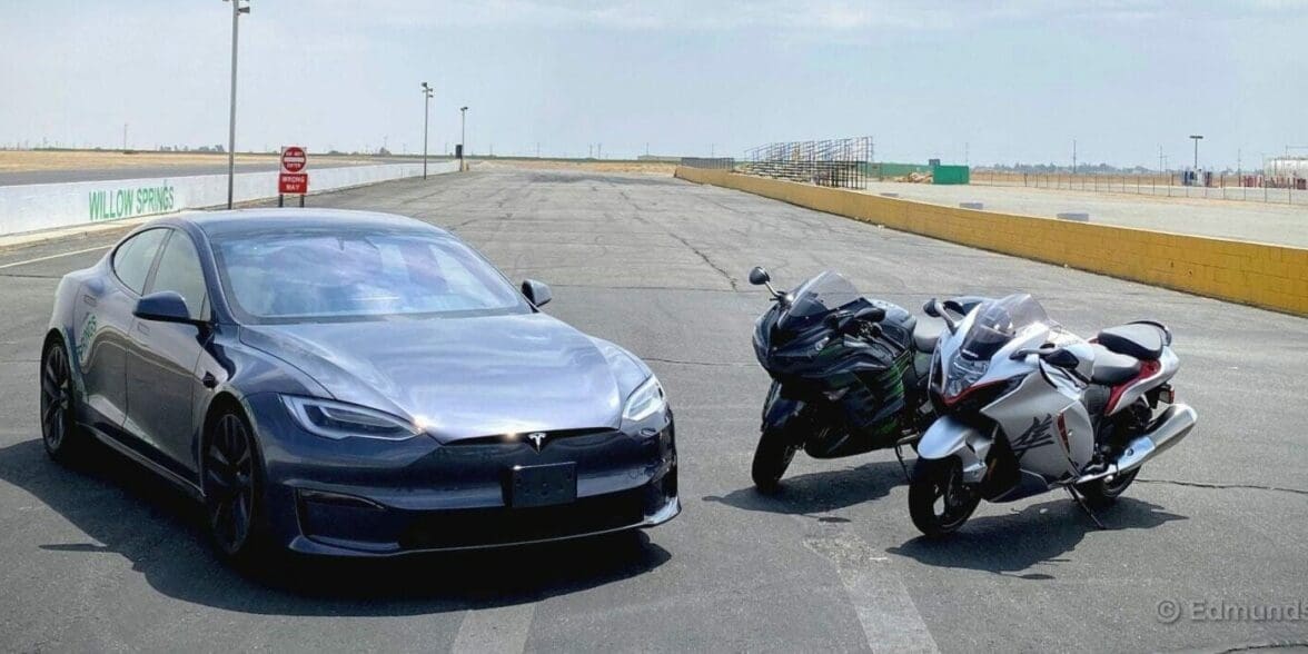 A view of a Tesla Model S Plaid, a 2022 Suzuki Hayabusa and a 2021 Kawasaki Ninja ZX-14R ready to race