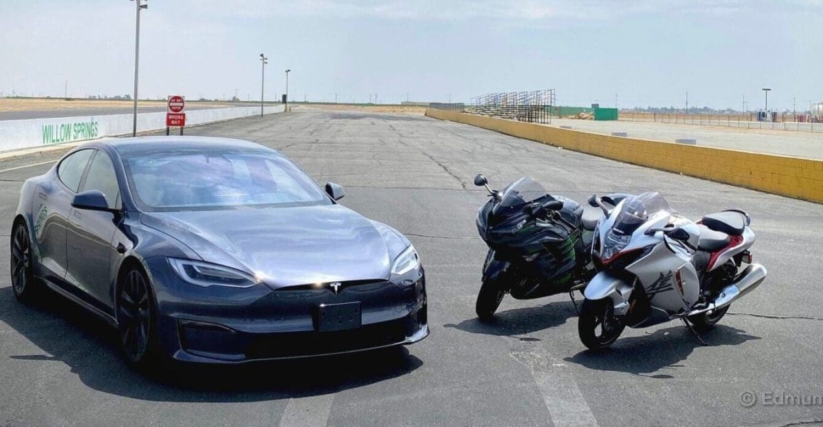 A view of a Tesla Model S Plaid, a 2022 Suzuki Hayabusa and a 2021 Kawasaki Ninja ZX-14R ready to race