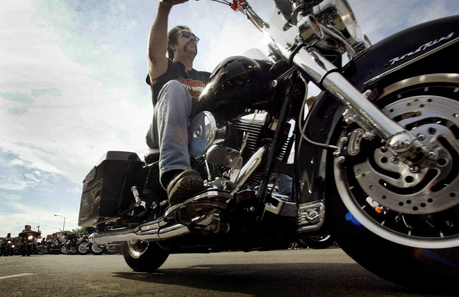 A view of a rider try gin out a Harley-Davidson motorcycle