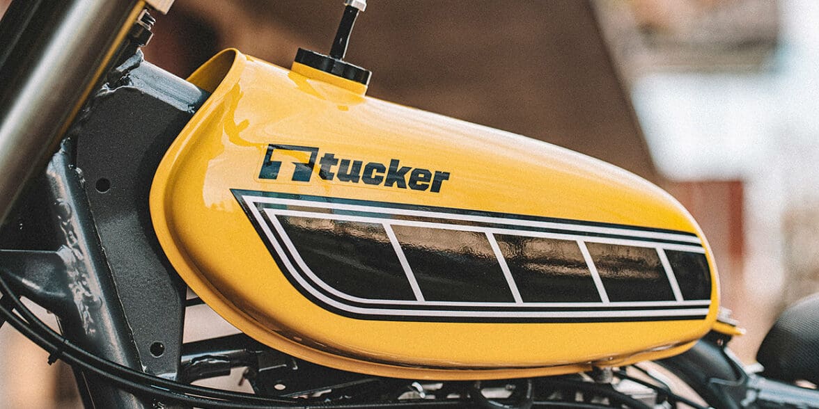 A view of a motorcycle with a Tucker Powersports brand name on the gas tank