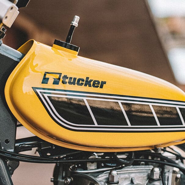 A view of a motorcycle with a Tucker Powersports brand name on the gas tank