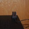 A view of the AKASO V50 Pro SE Action Camera batteries, charging in their mount.