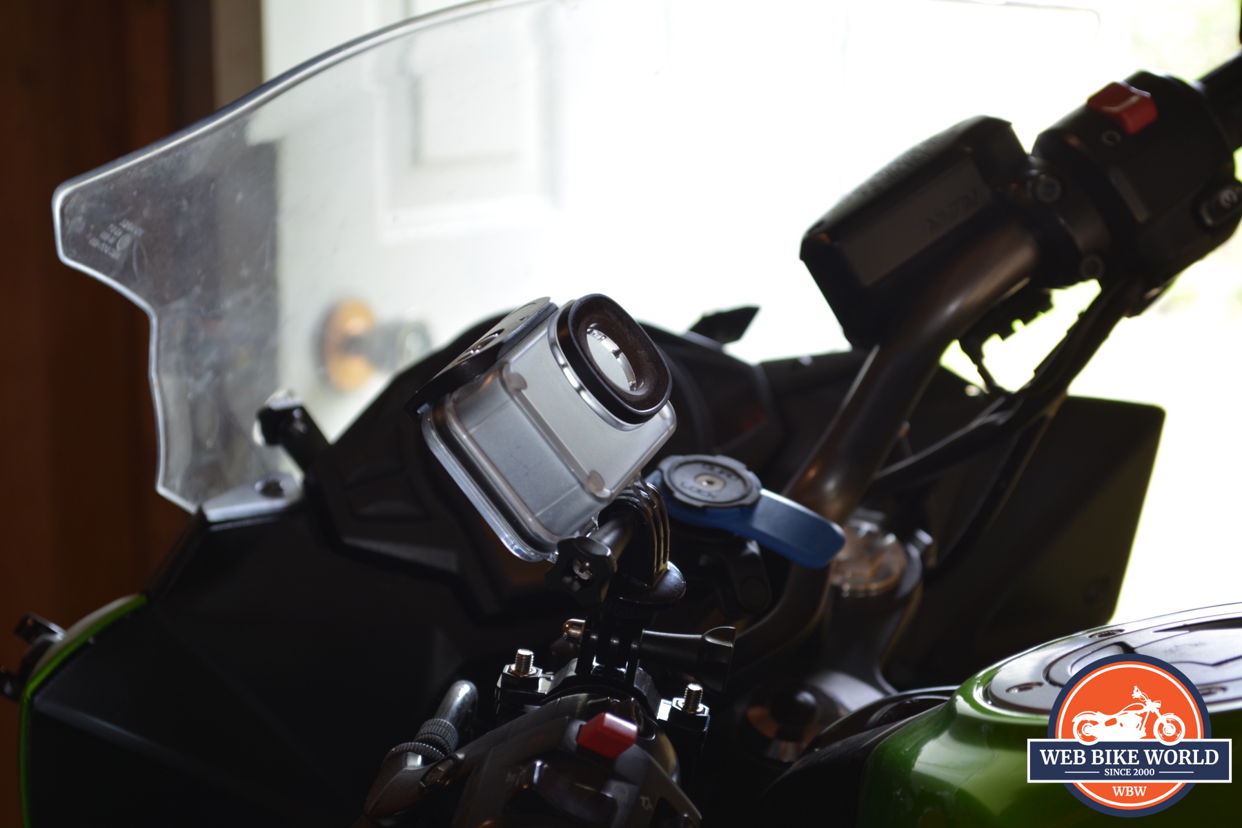 A view of the AKASO V50 Pro SE Action Camera plastic mount on a motorcycle