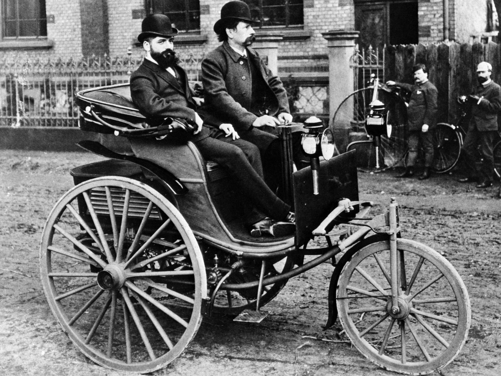 1884: Carl Benz with his patented automobile.