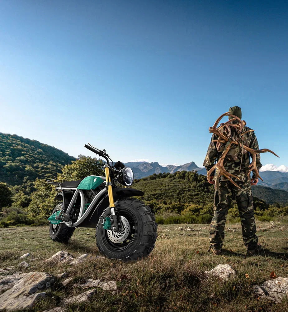 A view of a hunter and his Grunt, an all-terrain electric motorcycle available from Volcon Powersports