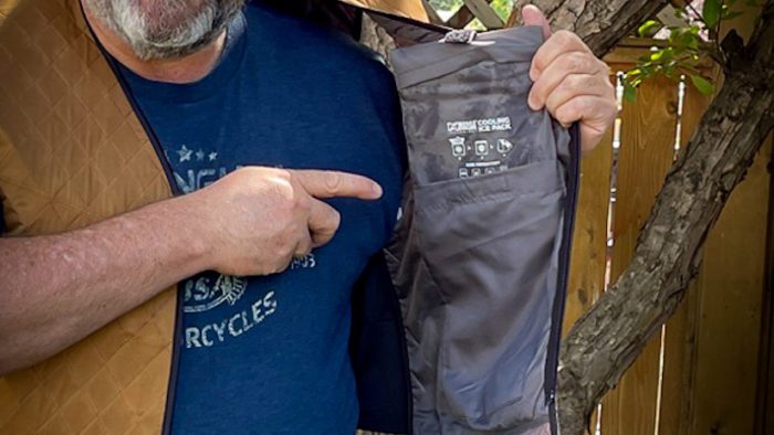 A view of Jared the reviewer displaying the pockets for the ice packs