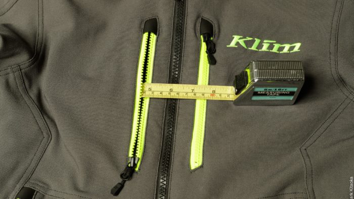 Measuring tape showing 4.75 depth for front zipper pocket