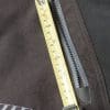 Closeup showing thigh pocket zipper opening about 5.5”