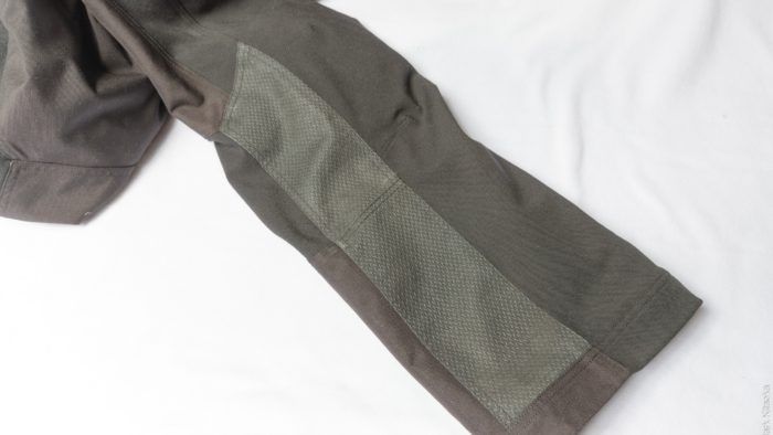 Heat shield material on the inner calf of each leg. Heat shield material on the inner calf of each leg.