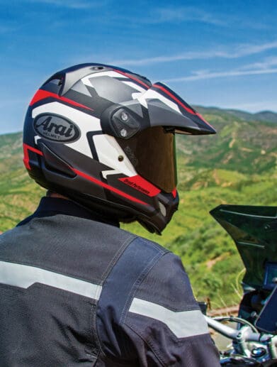 A view of a rider trying out the Arai XD4, with a rugged topography in the background