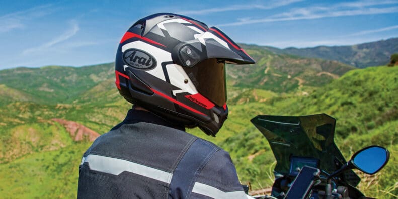 A view of a rider trying out the Arai XD4, with a rugged topography in the background