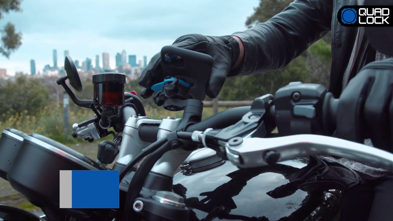 A view of a rider trying out the motorcycle phone mount