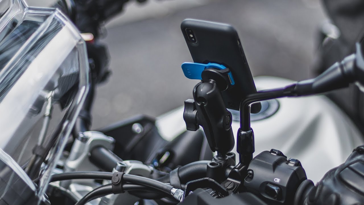 A view of a motorcycle featuring the Quad Lock motorcycle phone mount