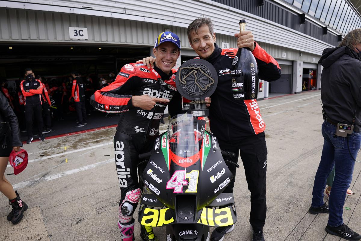 Massimo Ravola, CEO of Aprilia Racing, with Maverick Vinales, smiling over the RS-GP