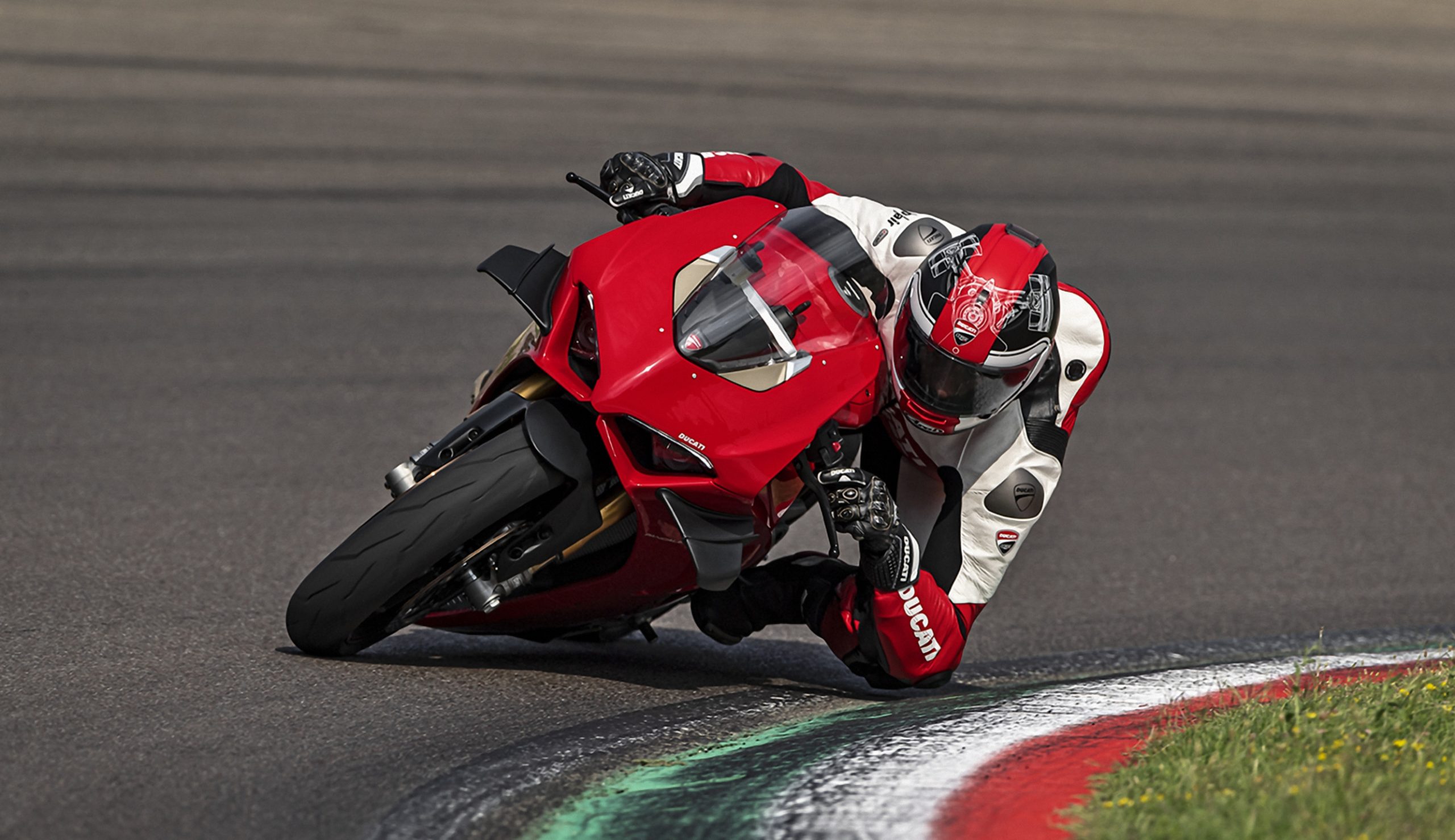 A view of a rider from Team Ducati leaning into the twisties
