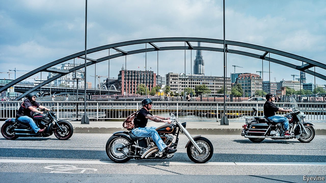 A view of three hog riders cruising downtown together