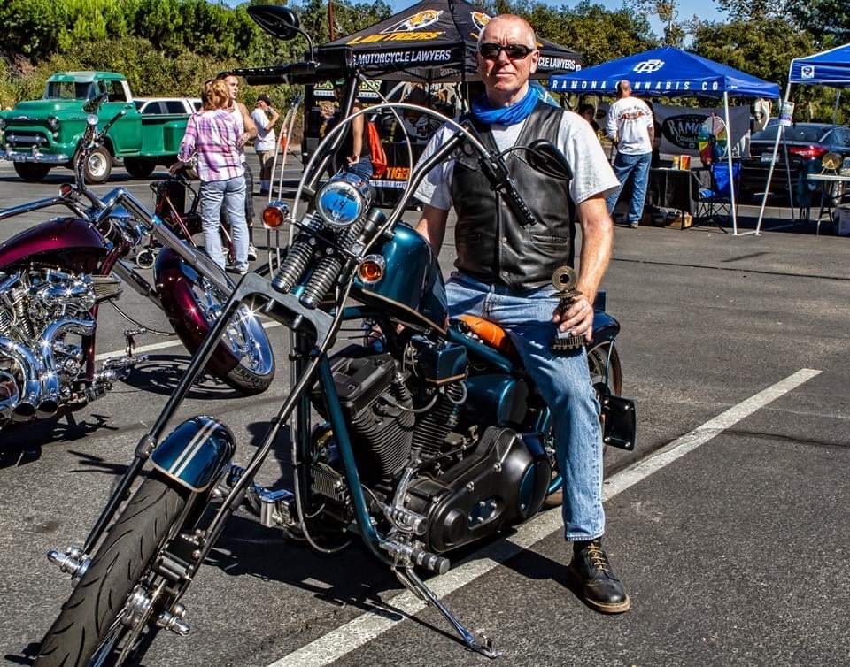 A view of a man entering his custom motorcycle in the Ramona Motorcycle Show