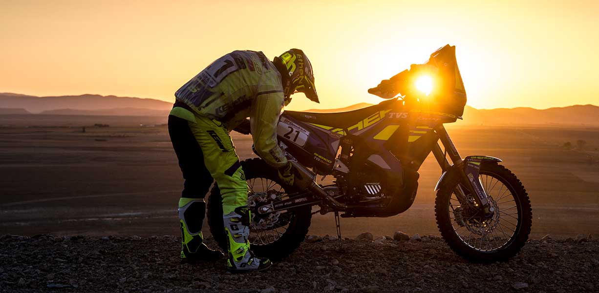 A rider racing in an enduro event similar to the 2021 Morocco Rally or the Dakar Rally
