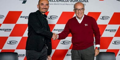 Claudio Domenicali and Carmelo Ezpeleta shake hands during the agreement for Ducati to be the official supplier for Dorna Sports MotoE category