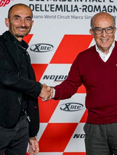 Claudio Domenicali and Carmelo Ezpeleta shake hands during the agreement for Ducati to be the official supplier for Dorna Sports MotoE category