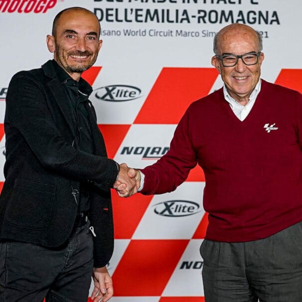 Claudio Domenicali and Carmelo Ezpeleta shake hands during the agreement for Ducati to be the official supplier for Dorna Sports MotoE category