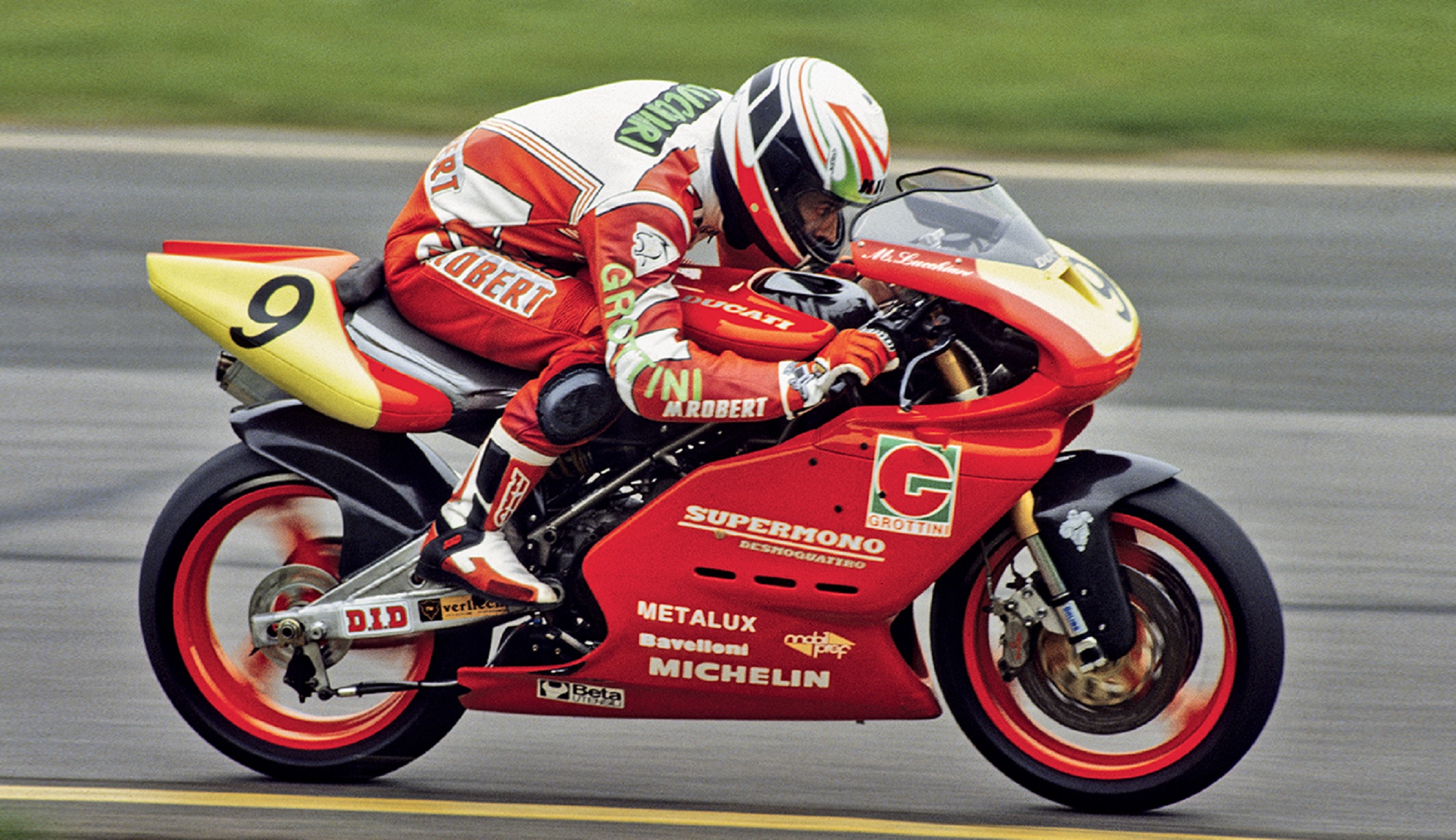 A view of a rider leaning into the Ducati Supermono