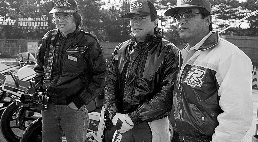 Etsuo Yokouchi (right) with racer Graeme Crosby (center) and John Ulrich (left) at the introduction of the 1985 GSX-R750 at the Ryuyo test track in Japan. Photo by Masao Suzuki, curated from RoadRacingWorld