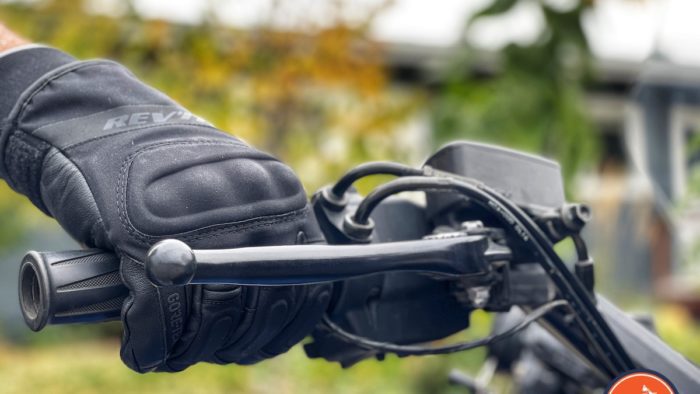 A view of Rev'it Kryptonite 2 GTX Gloves gripping the bars of a 2001 Honda Goldwing