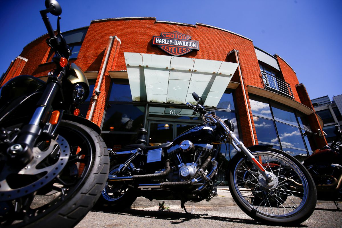 A view of a Harley-Davidson dealership with a couple of H-D motorcycles in front